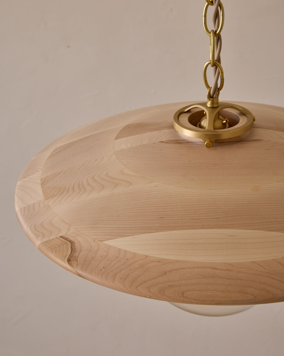 Large pendant light with oversized clear glass globe and decorative wooden clear maple shade with brass chain #shade-finish_clear maple #globe_clear glass #cord-color_beige