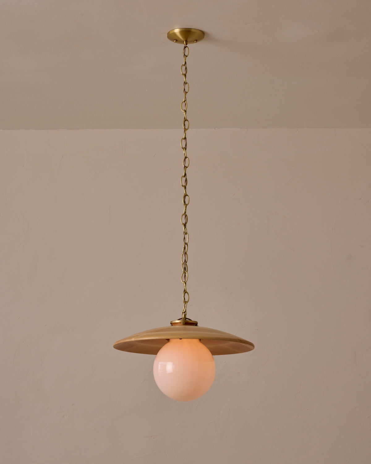 Large pendant light with oversized clear glass globe and decorative wooden clear maple shade with brass chain #shade-finish_natural maple #globe_white glass #cord-color_beige