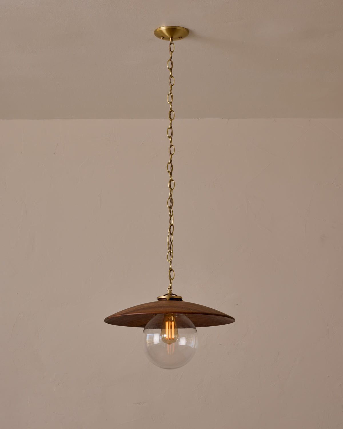 Large pendant light with oversized clear glass globe and decorative wooden clear maple shade with brass chain #shade-finish_black walnut #globe_clear glass #cord-color_beige