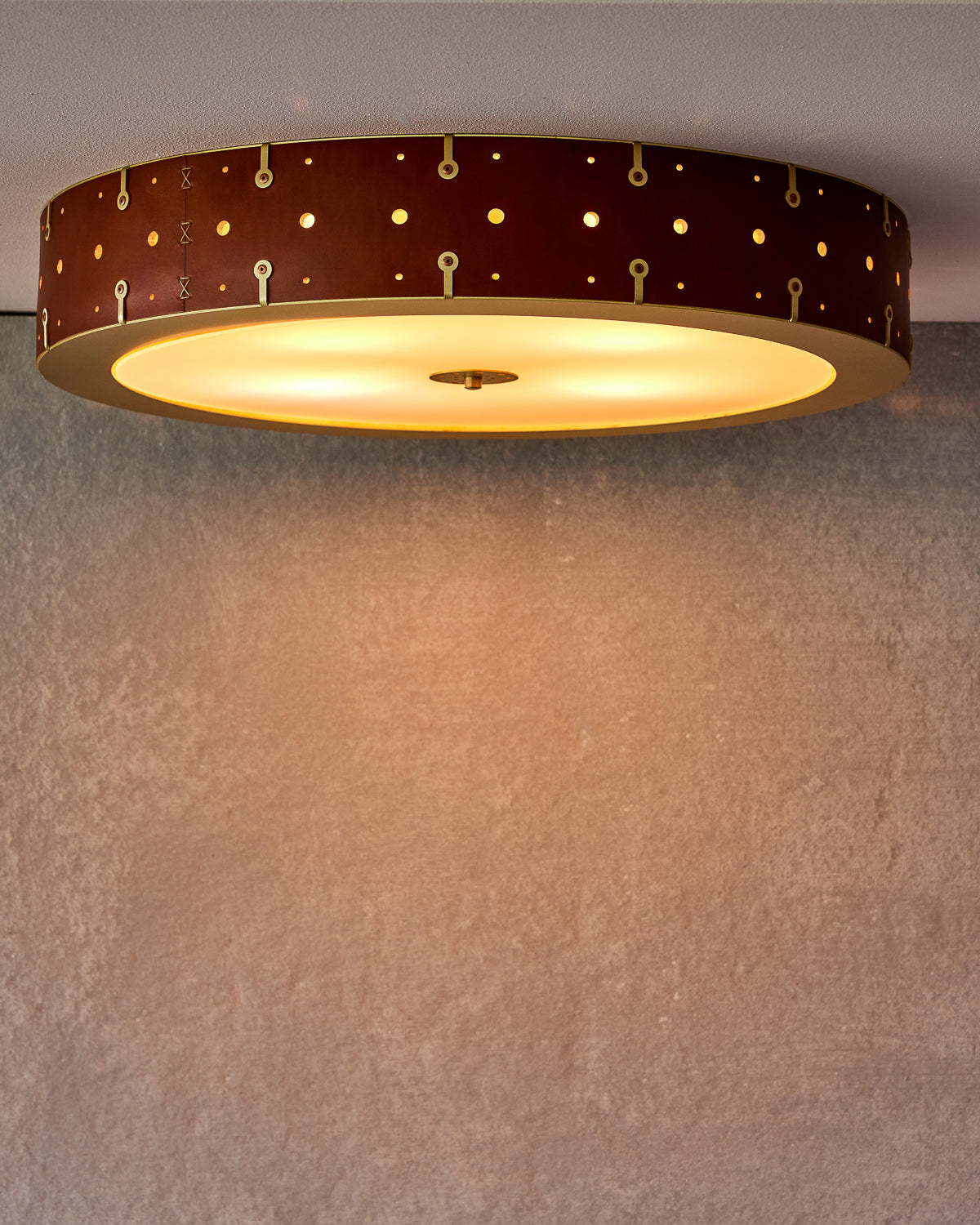 Beautiful satin brass flush mount ceiling fixture with handstitched leather drum shade #leather-finish_tan harness #size_24" drum