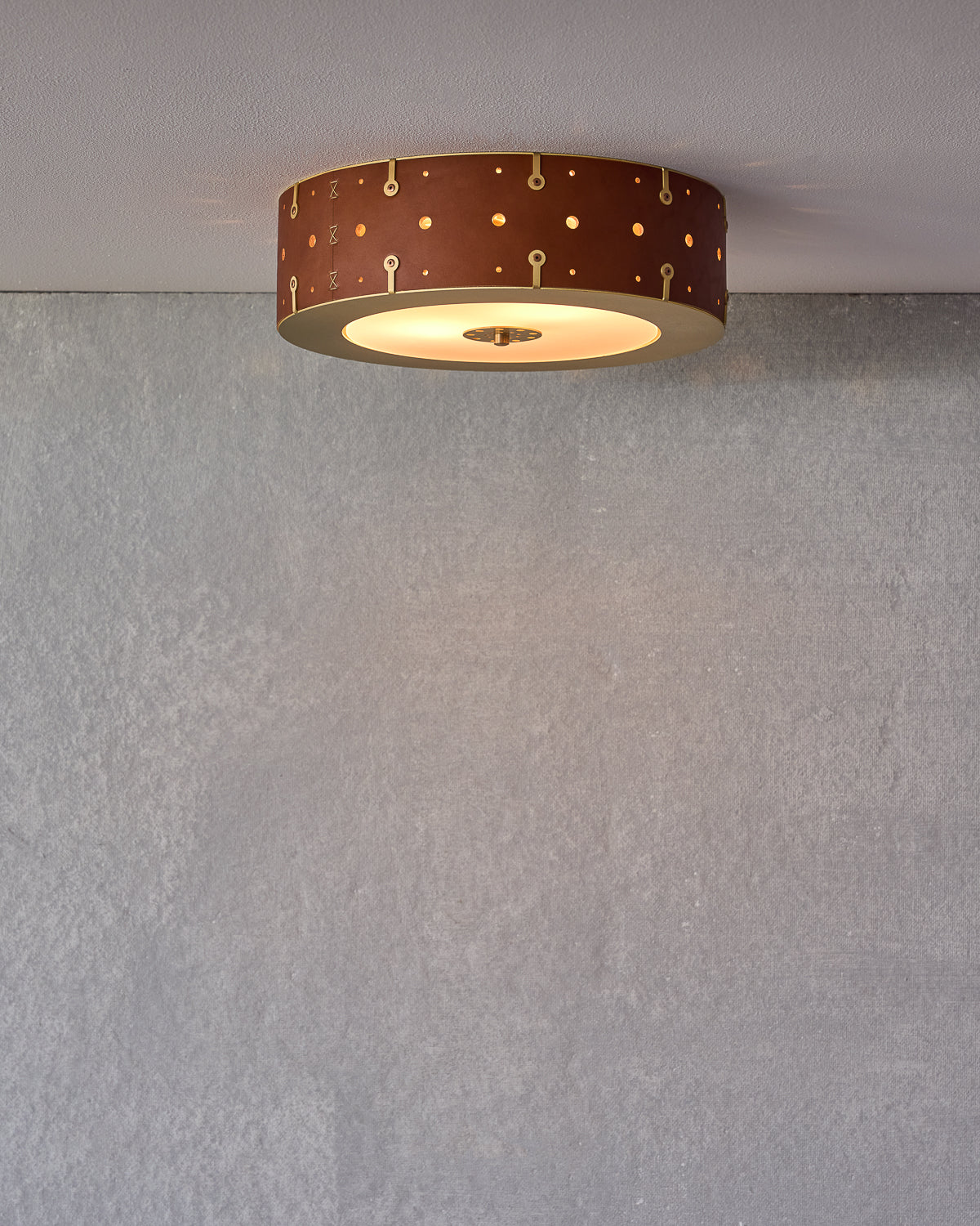 Beautiful satin brass flush mount ceiling fixture with handstitched leather drum shade #size_14" drum #leather-finish_tan harness