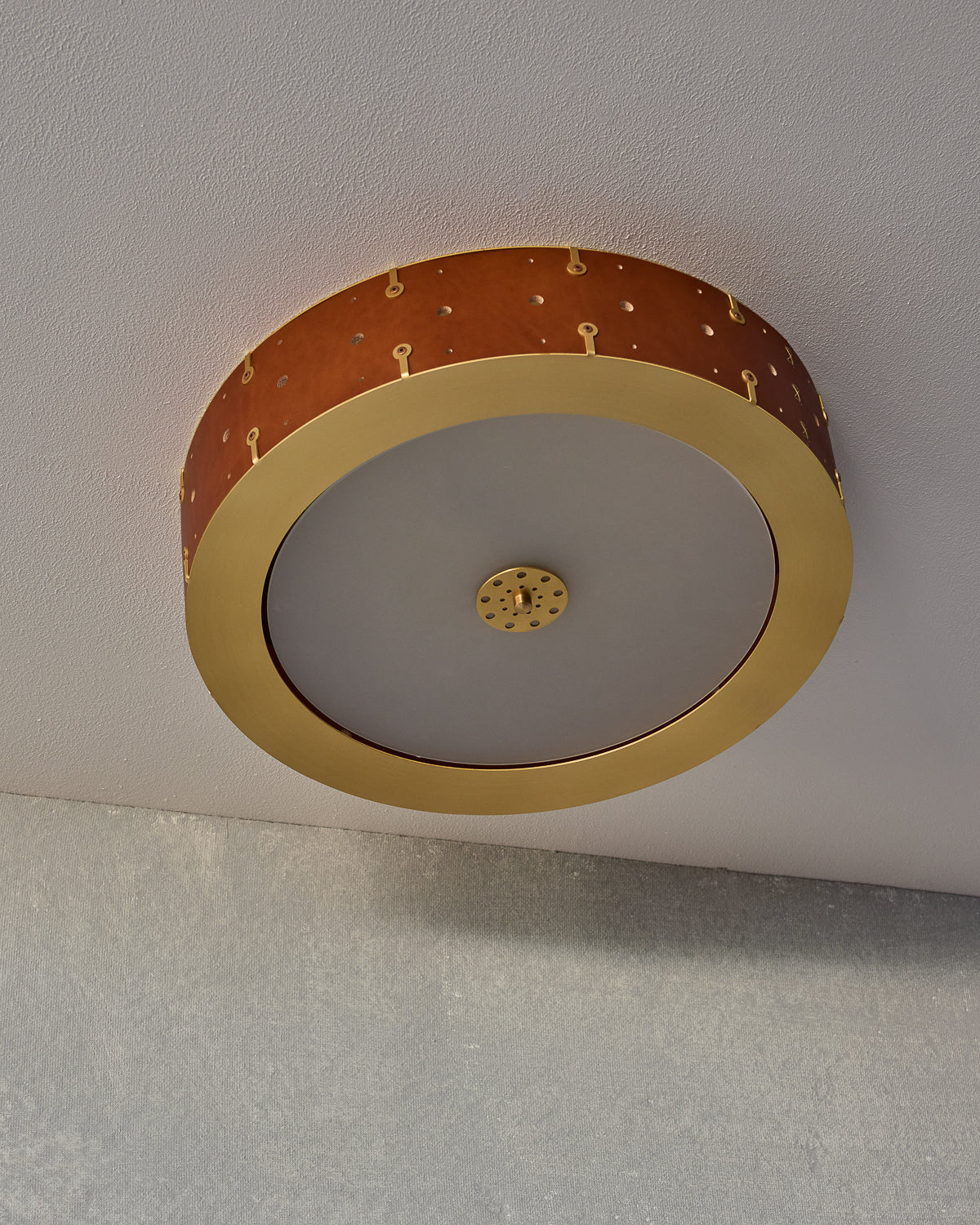 Beautiful satin brass flush mount ceiling fixture with handstitched leather drum shade #leather-finish_tan harness #size_18" drum