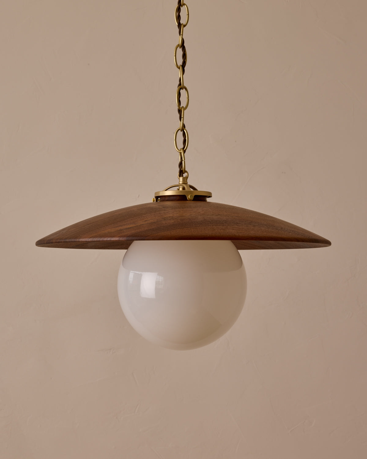 Large pendant light with oversized clear glass globe and decorative wooden clear maple shade with brass chain #shade-finish_black walnut #globe_white glass #cord-color_brown