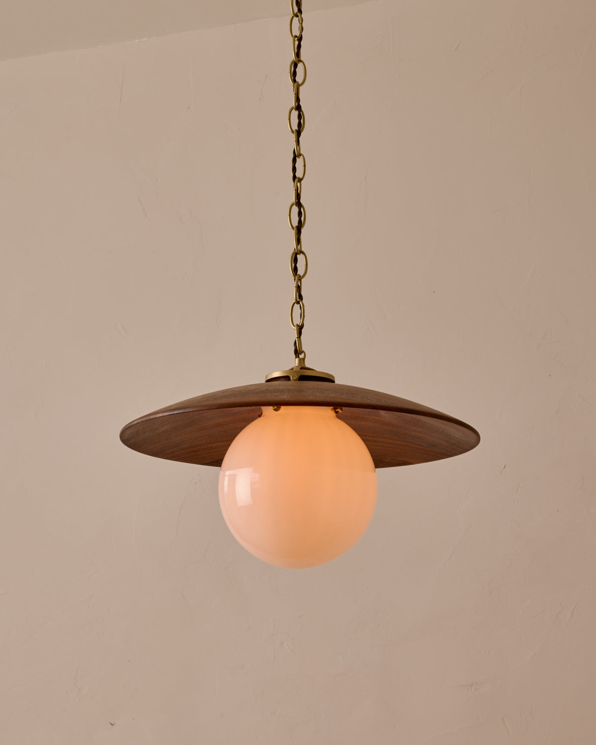 Large pendant light with oversized clear glass globe and decorative wooden clear maple shade with brass chain #shade-finish_black walnut #globe_white glass #cord-color_brown