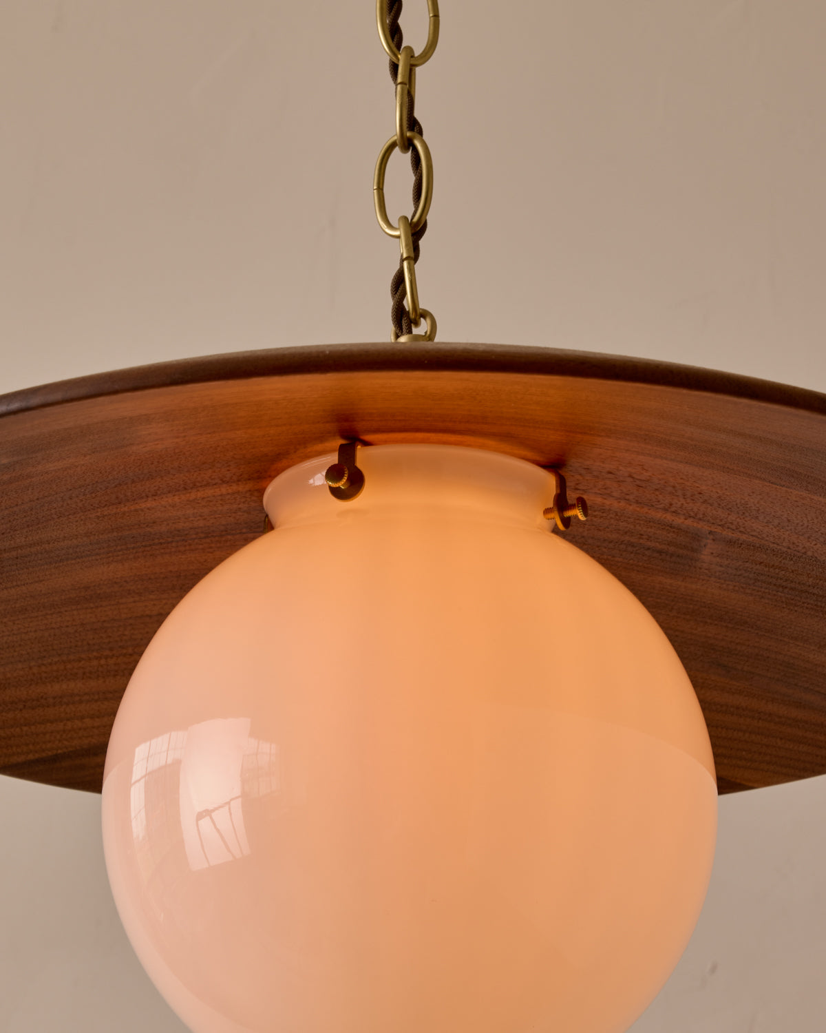Large pendant light with oversized clear glass globe and decorative wooden clear maple shade with brass chain #shade-finish_black walnut #globe_white glass #cord-color_brown