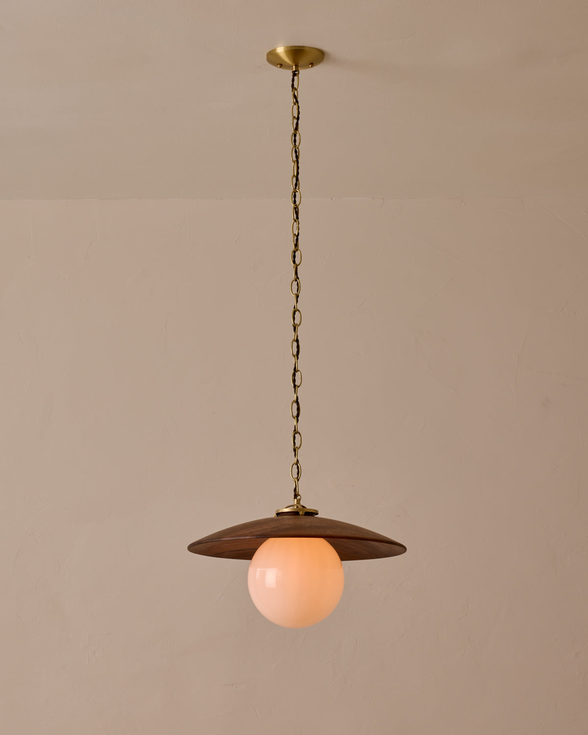 Large pendant light with oversized clear glass globe and decorative wooden clear maple shade with brass chain #shade-finish_black walnut #globe_white glass #cord-color_brown