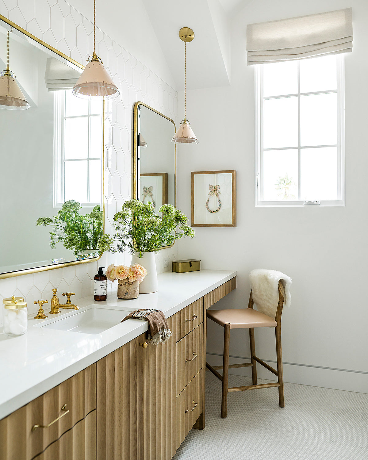 Classic cone pendants with hand-stitched decorative leather shade and glass diffuser hanging over bathroom sink
#leather-finish_natural tan