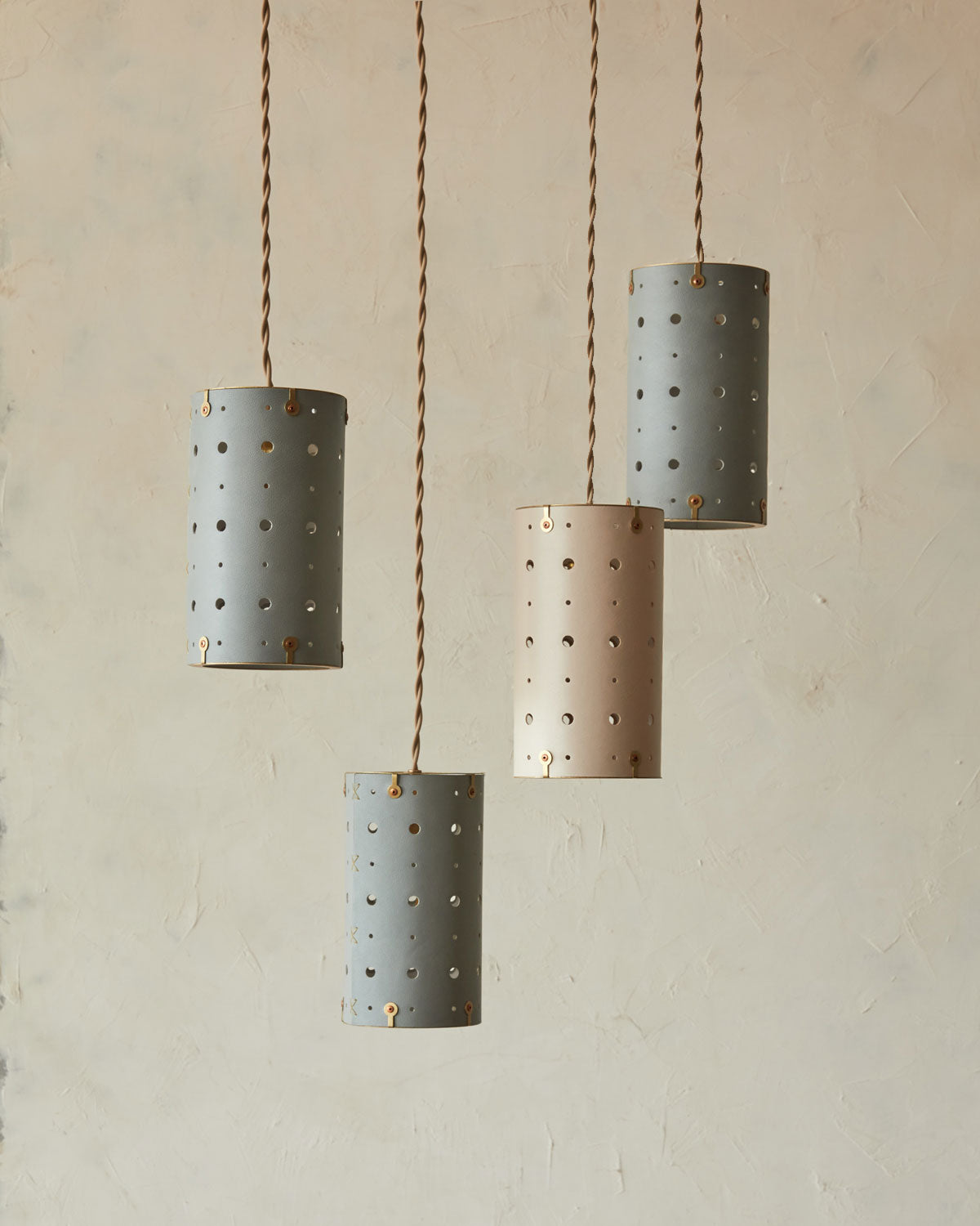 Charming leather pendant light with handstitched shade and brass accents
#color_dogwood