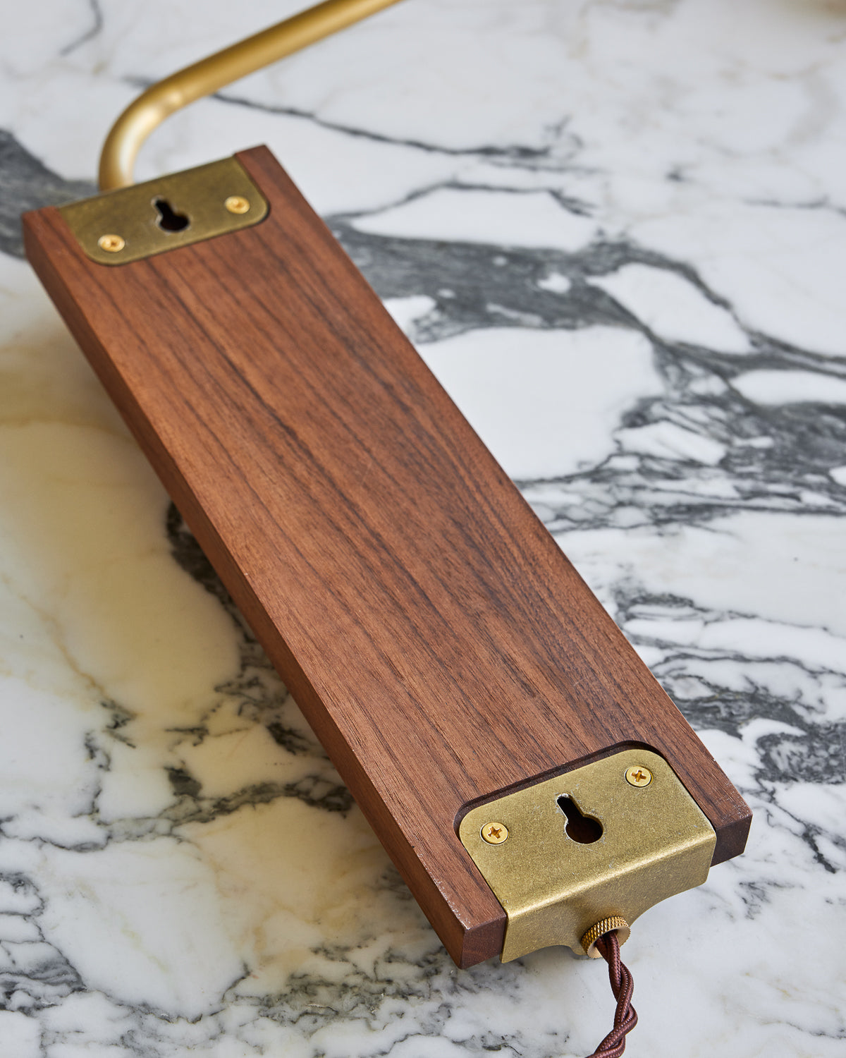 Black walnut wooden plug in wall sconce with articulating brass arm #wood-finish_black walnut #wiring_plug-in