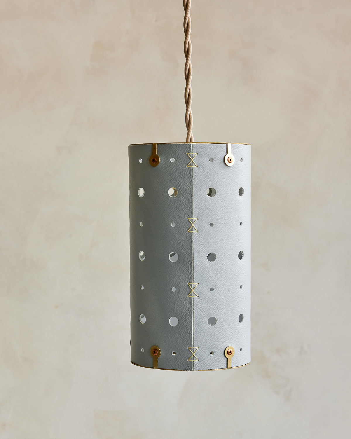 Charming leather pendant light with blue handstitched shade and brass accents #color_cloud blue