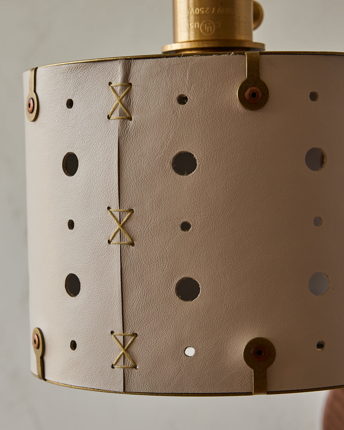 Articulating satin brass plug-in wall sconce with white handstitched shade and walnut backplate #leather-finish_dogwood