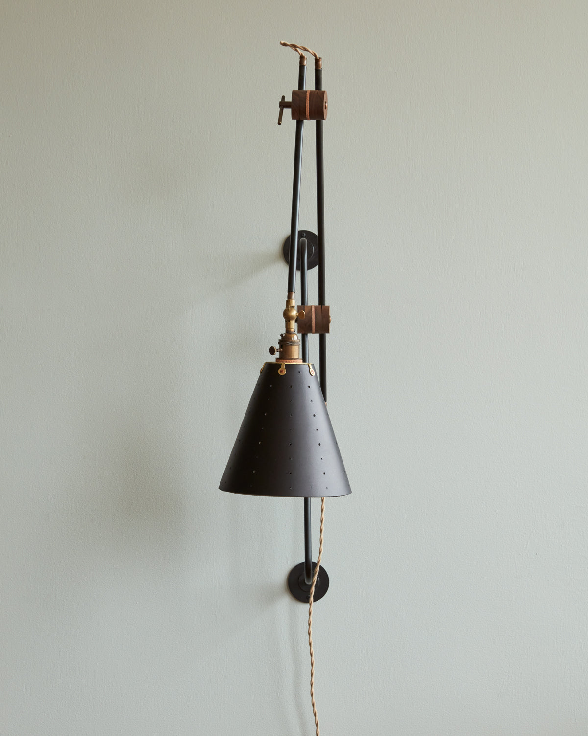 Large articulating black plug in wall sconce with black handstitched cone leather shade #shade-finish_black harness #wiring_plug-in