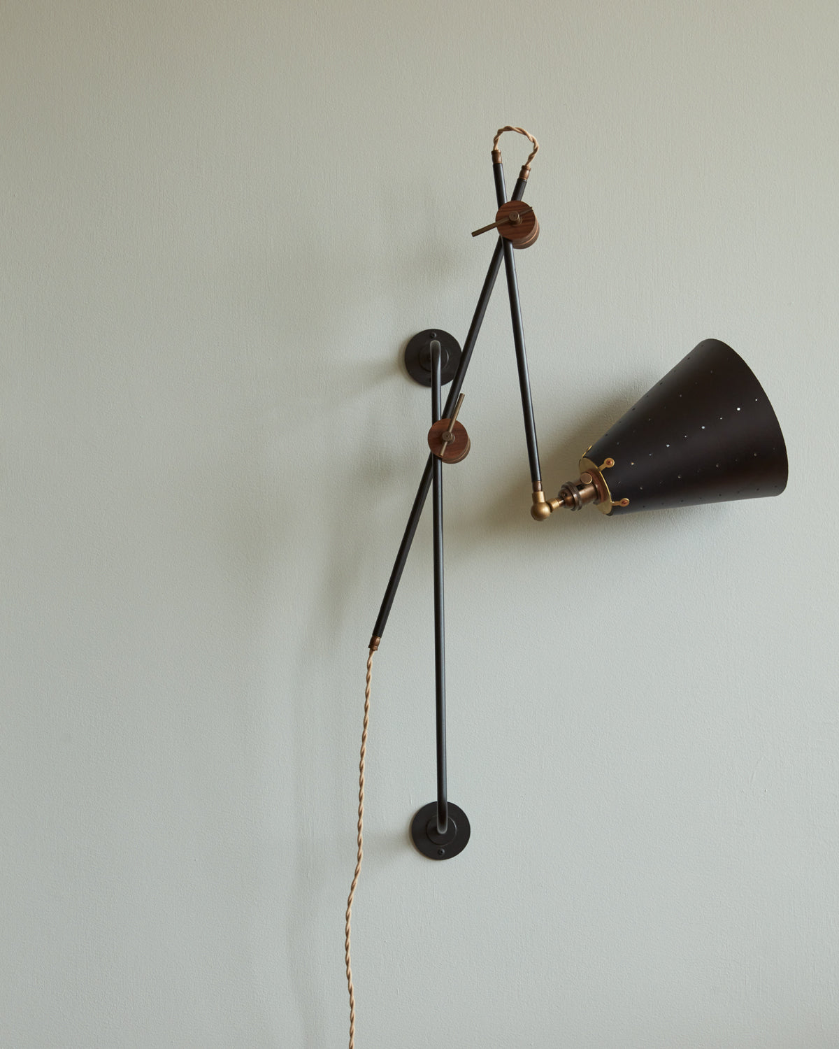 Large articulating black plug in wall sconce with black handstitched cone leather shade #shade-finish_black harness #wiring_plug-in