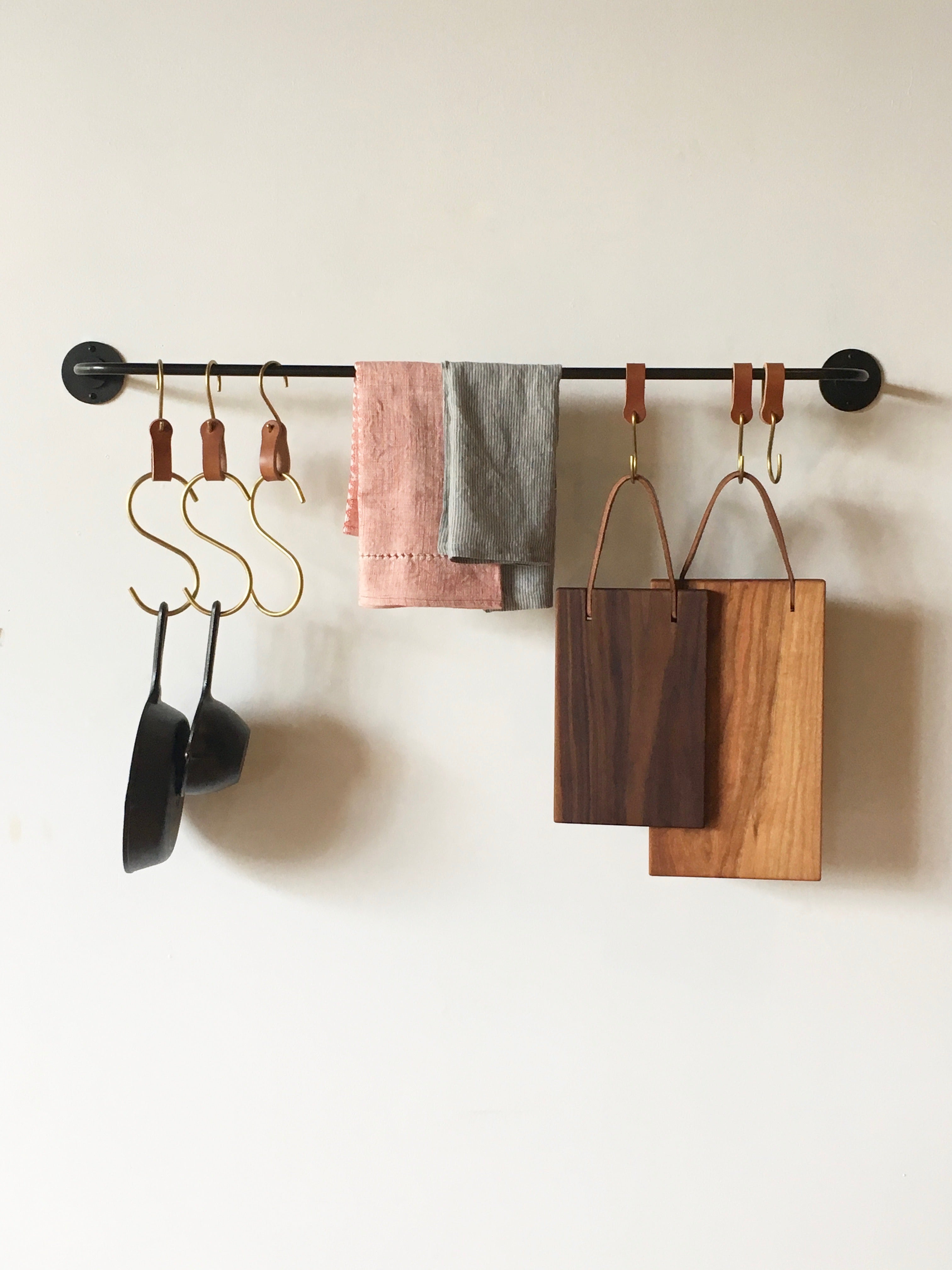 strong potrack with s hooks, cutting boards and iron pans 