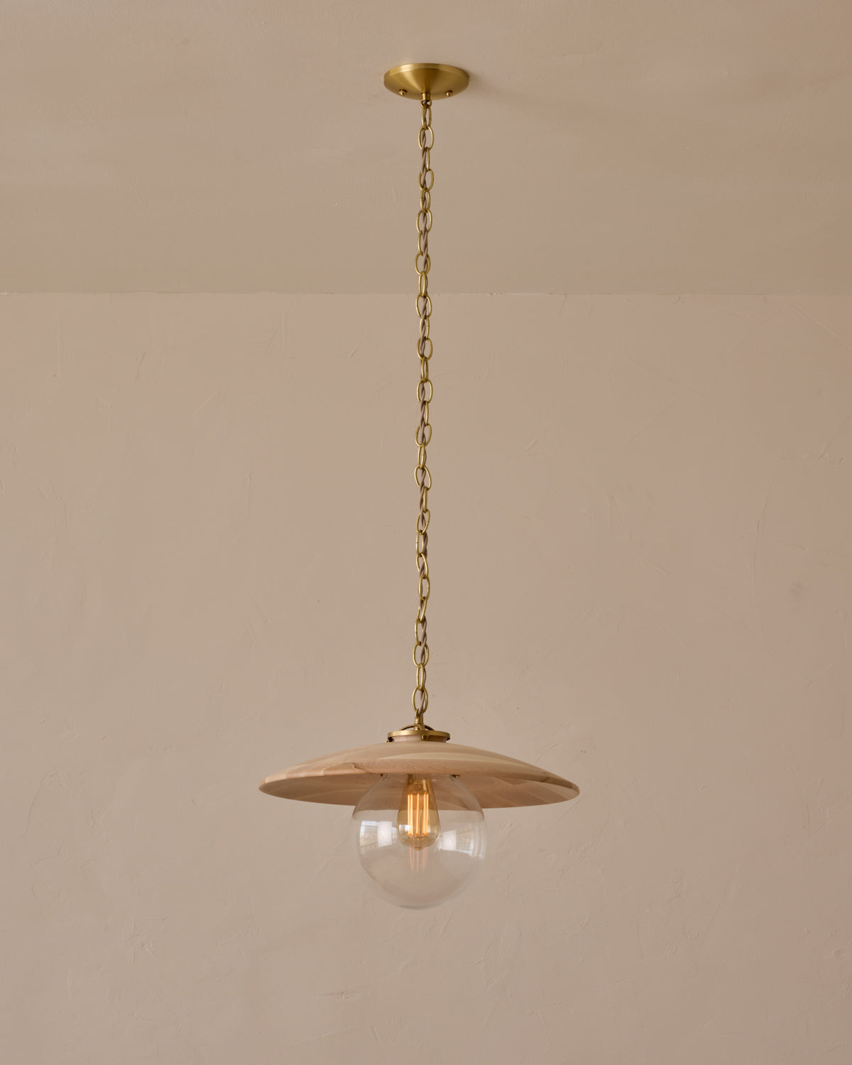 Large pendant light with oversized clear glass globe and decorative wooden clear maple shade with brass chain #shade-finish_clear maple #globe_clear glass #cord-color_beige