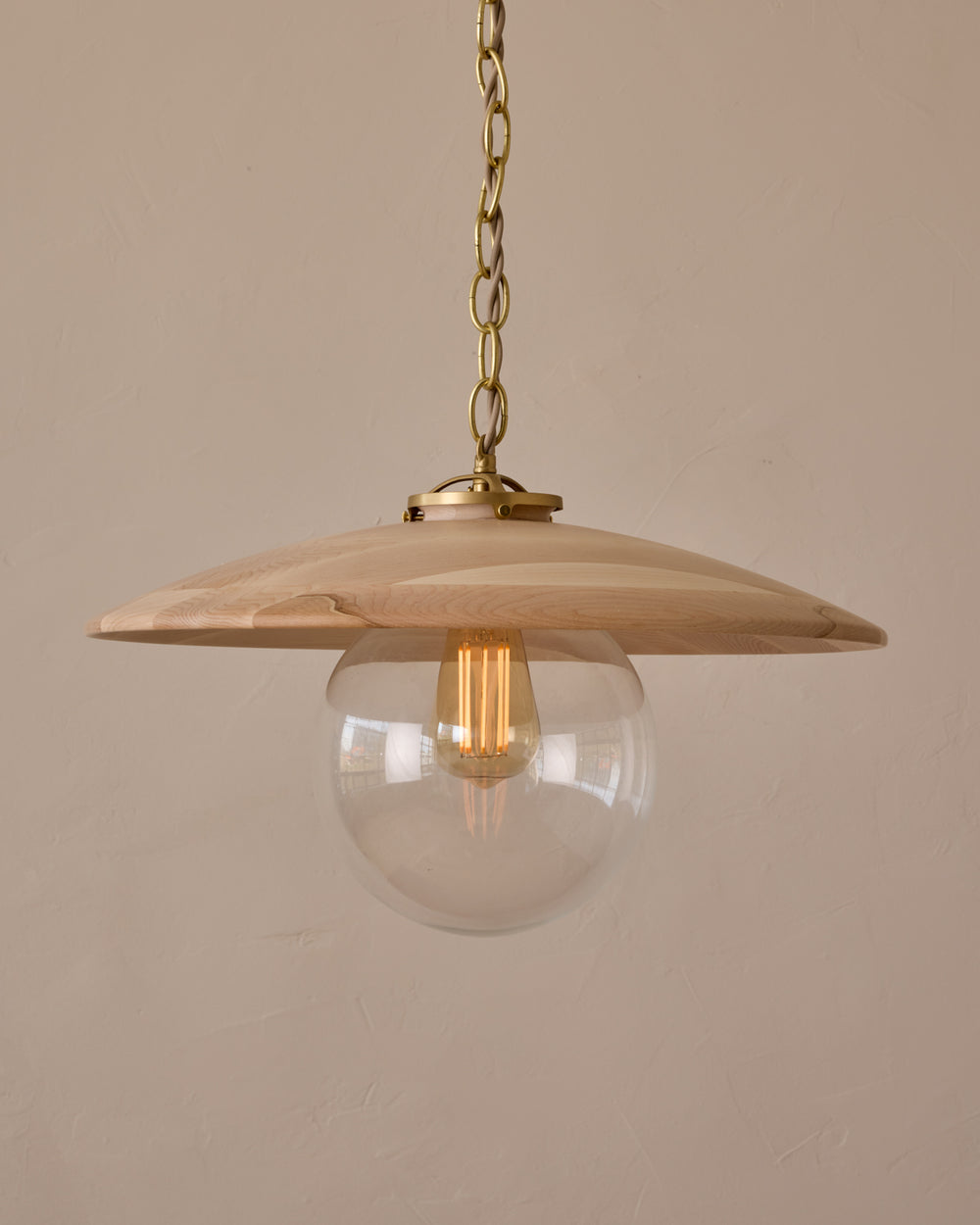Large pendant light with oversized clear glass globe and decorative wooden clear maple shade with brass chain #shade-finish_clear maple #globe_clear glass #cord-color_beige
