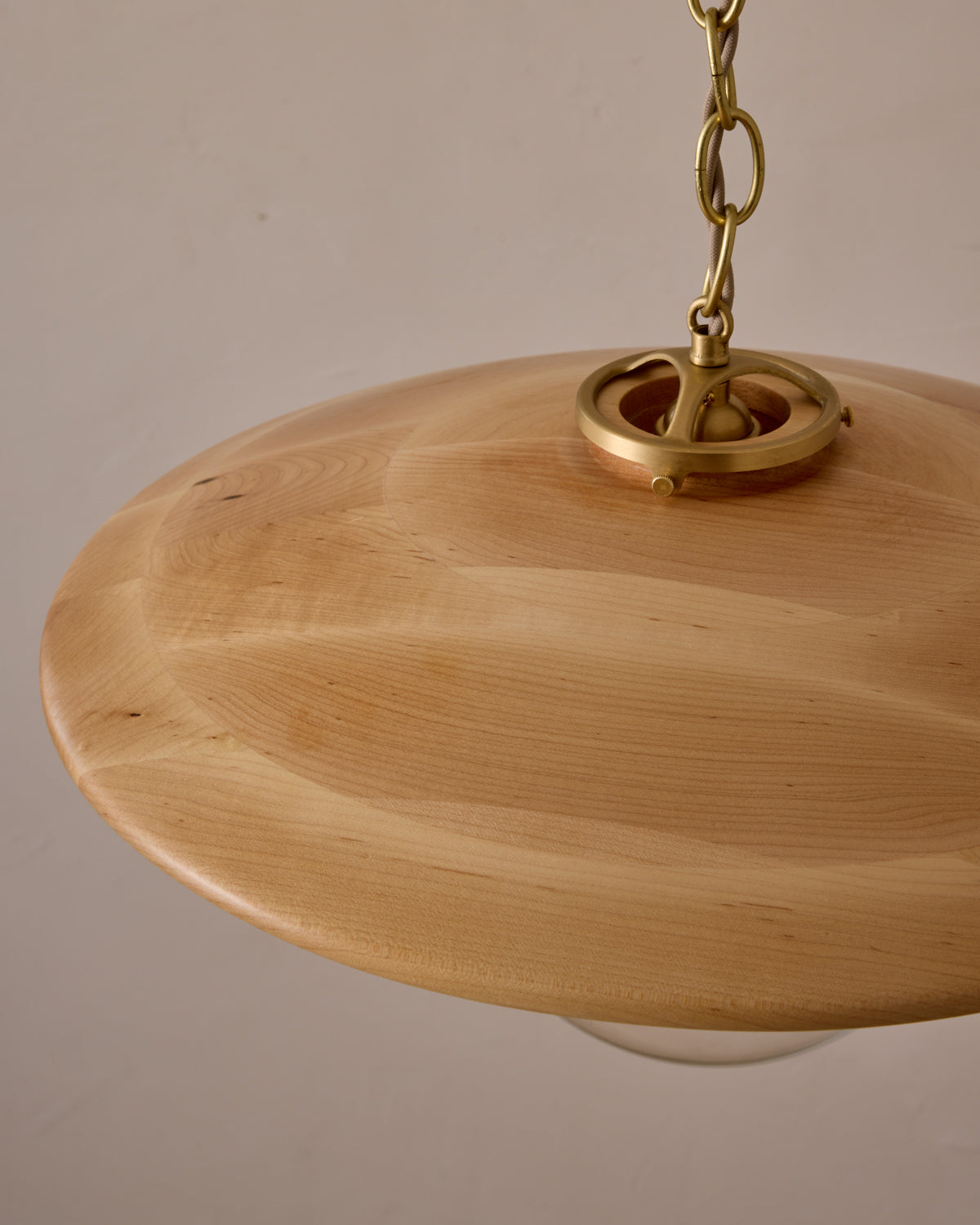 Large pendant light with oversized clear glass globe and decorative wooden clear maple shade with brass chain  #shade-finish_natural maple #globe_clear glass #cord-color_beige