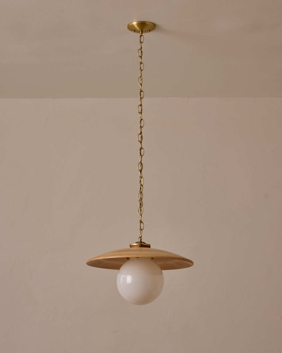 Large pendant light with oversized clear glass globe and decorative wooden clear maple shade with brass chain  #shade-finish_natural maple #globe_white glass #cord-color_beige