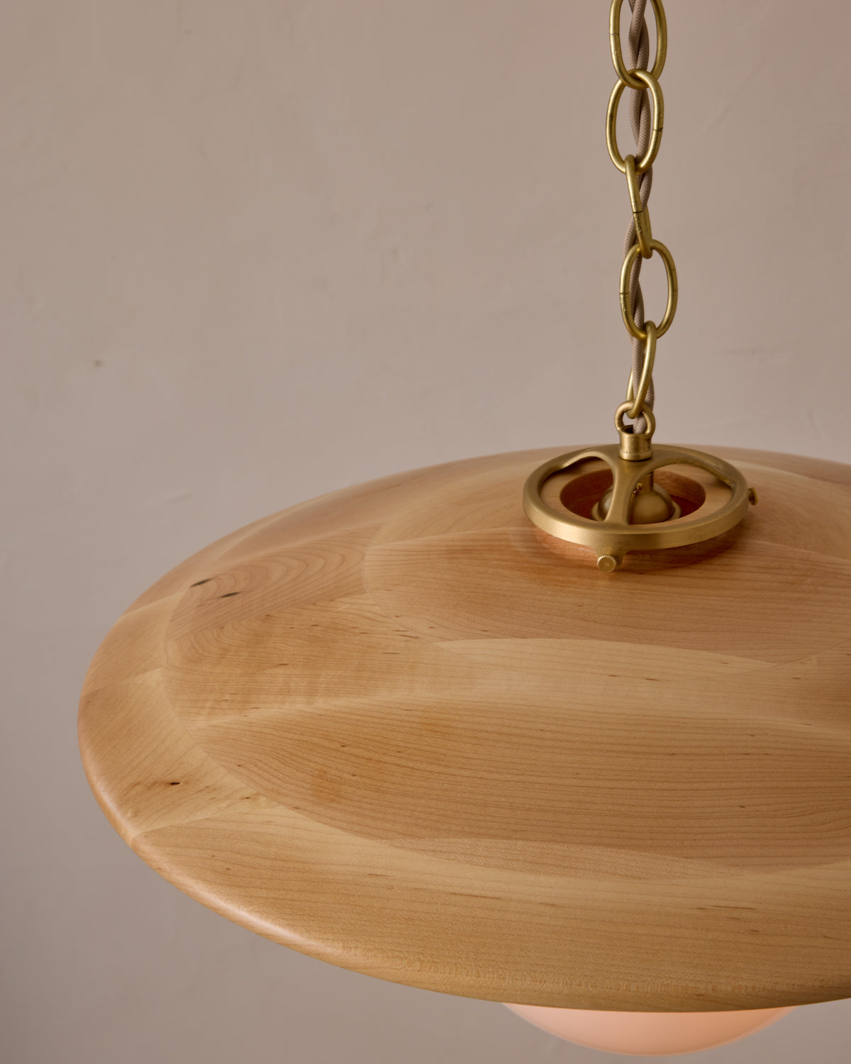 Large pendant light with oversized clear glass globe and decorative wooden clear maple shade with brass chain  #shade-finish_natural maple #globe_white glass #cord-color_beige