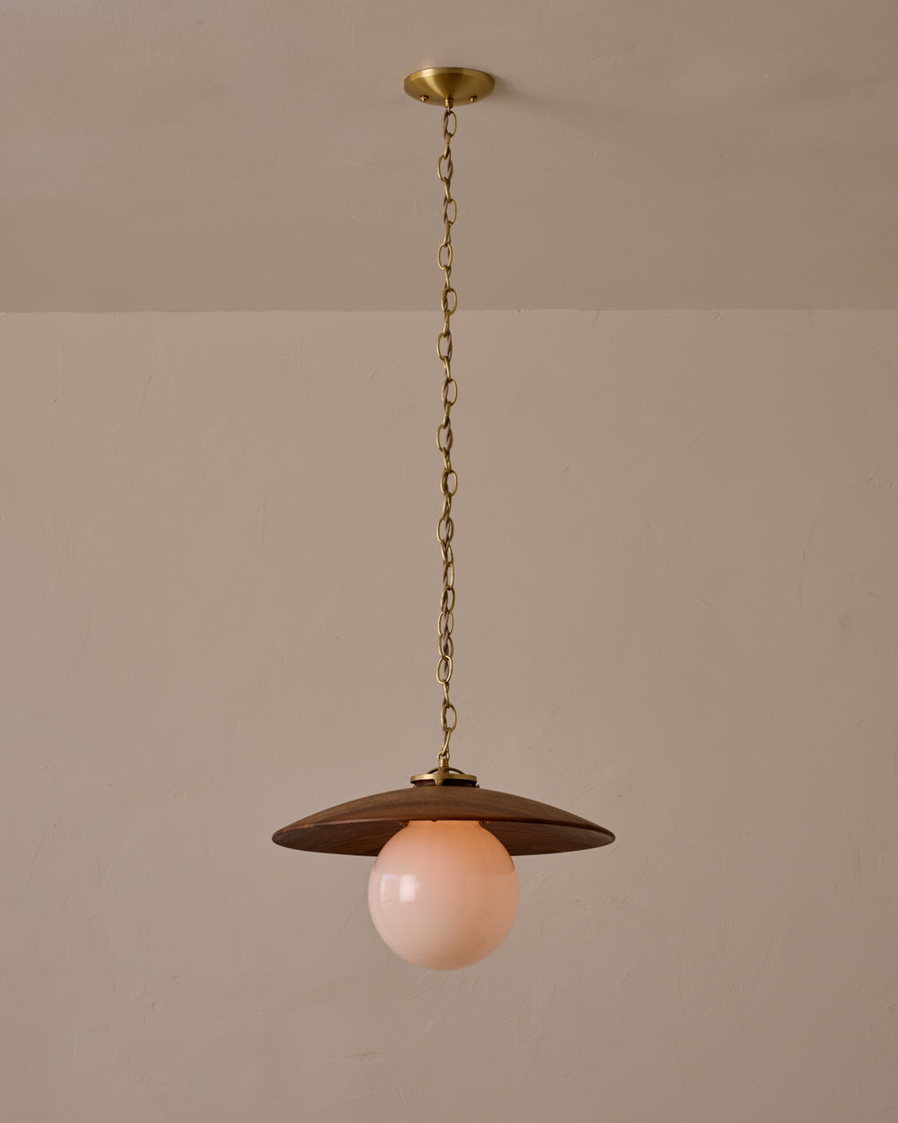 Large pendant light with oversized clear glass globe and decorative wooden clear maple shade with brass chain  #shade-finish_black walnut #globe_white glass #cord-color_beige