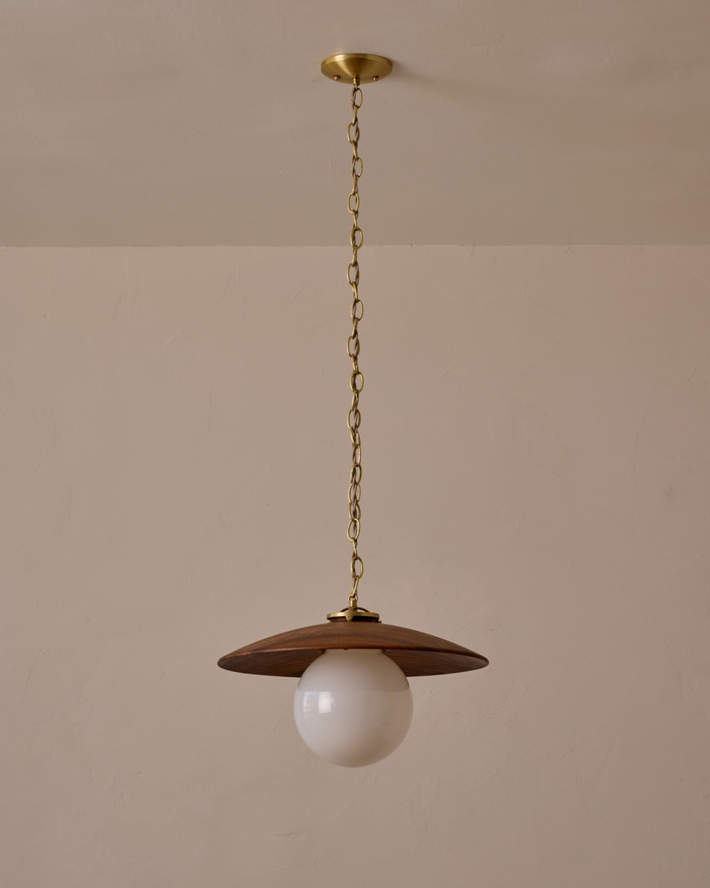Large pendant light with oversized clear glass globe and decorative wooden clear maple shade with brass chain  #shade-finish_black walnut #globe_white glass #cord-color_beige