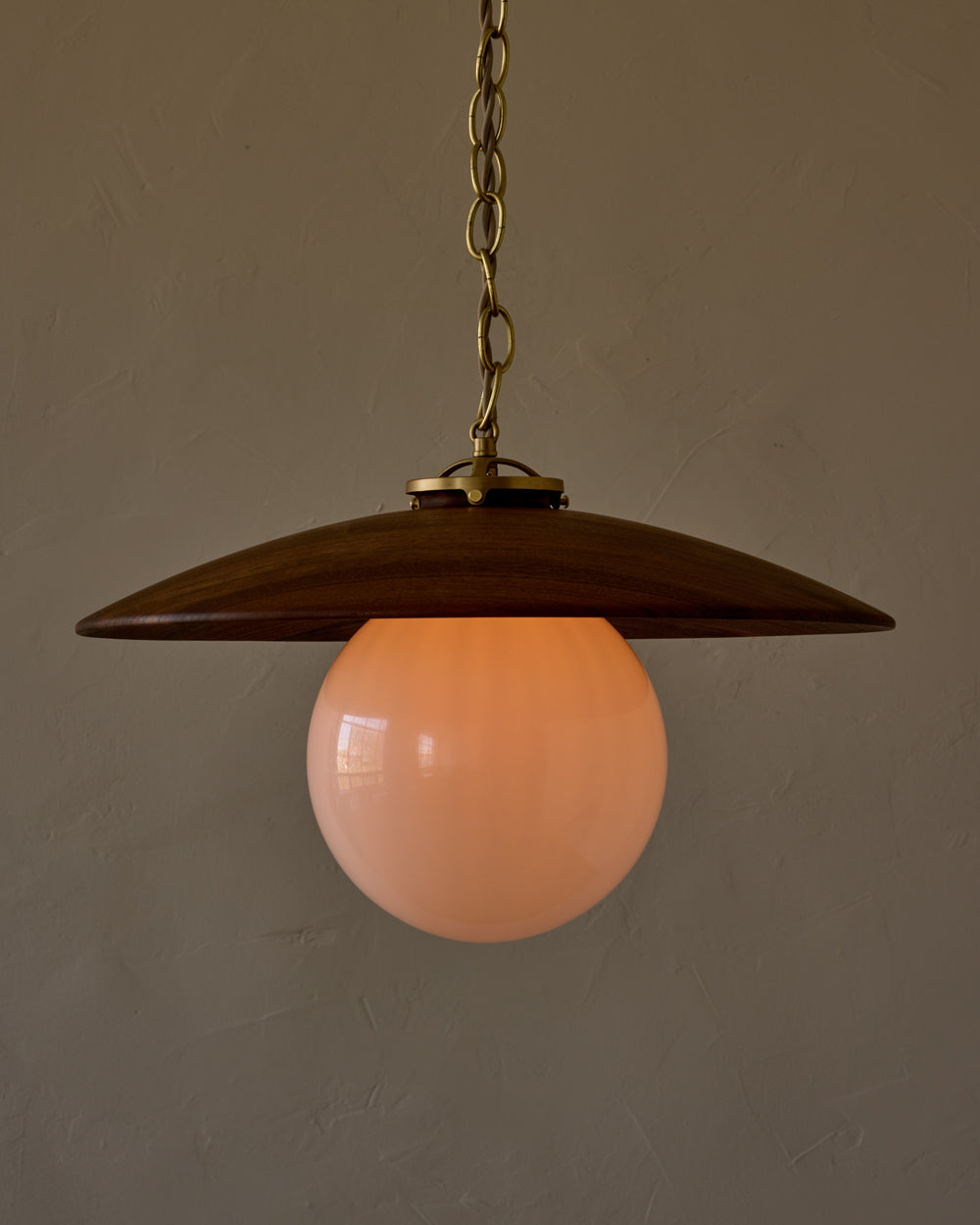 Large pendant light with oversized clear glass globe and decorative wooden clear maple shade with brass chain  #shade-finish_black walnut #globe_white glass #cord-color_beige