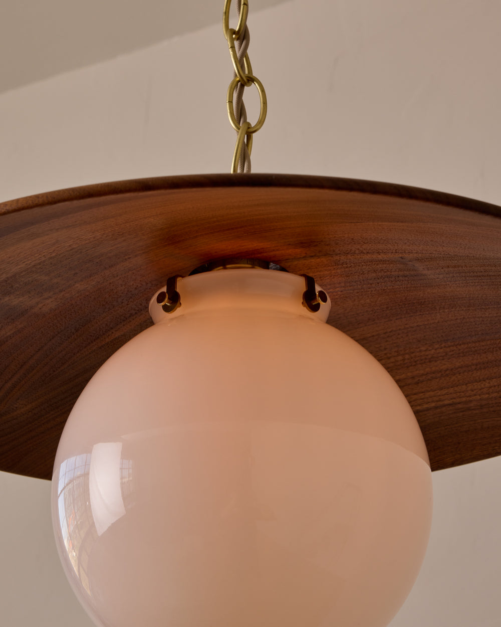 Large pendant light with oversized clear glass globe and decorative wooden clear maple shade with brass chain  #shade-finish_black walnut #globe_white glass #cord-color_beige