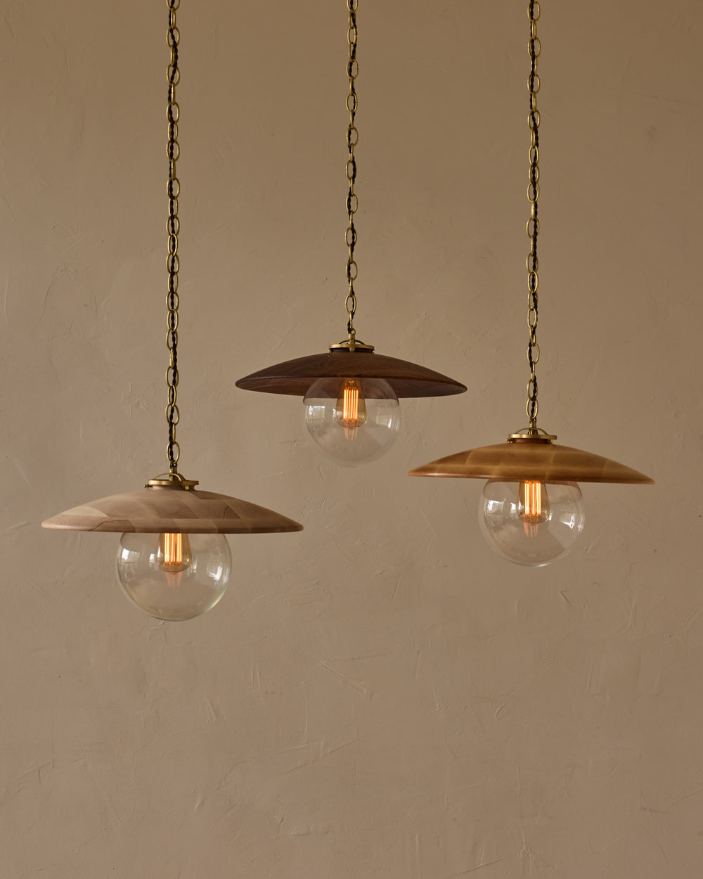 Large pendant light with oversized clear glass globe and decorative wooden clear maple shade with brass chain #shade-finish_clear maple #globe_clear glass #cord-color_brown