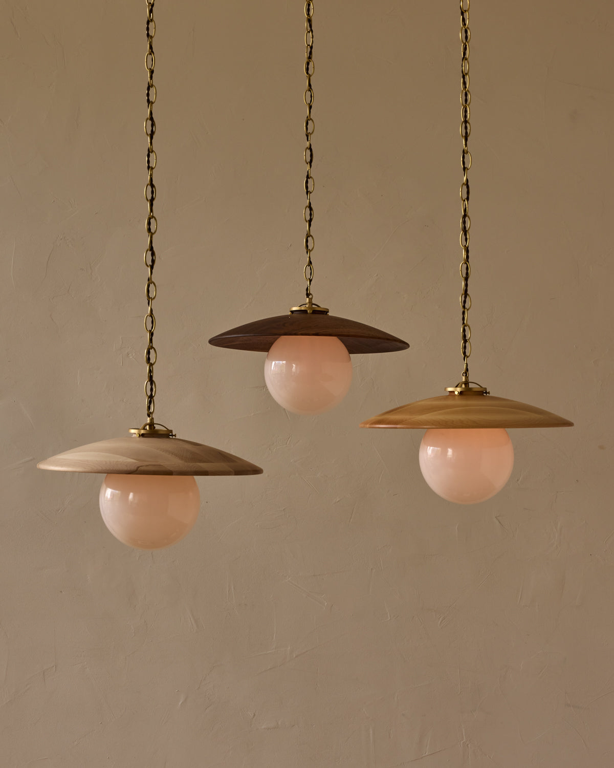 Large pendant light with oversized clear glass globe and decorative wooden clear maple shade with brass chain  #shade-finish_black walnut #globe_white glass #cord-color_brown