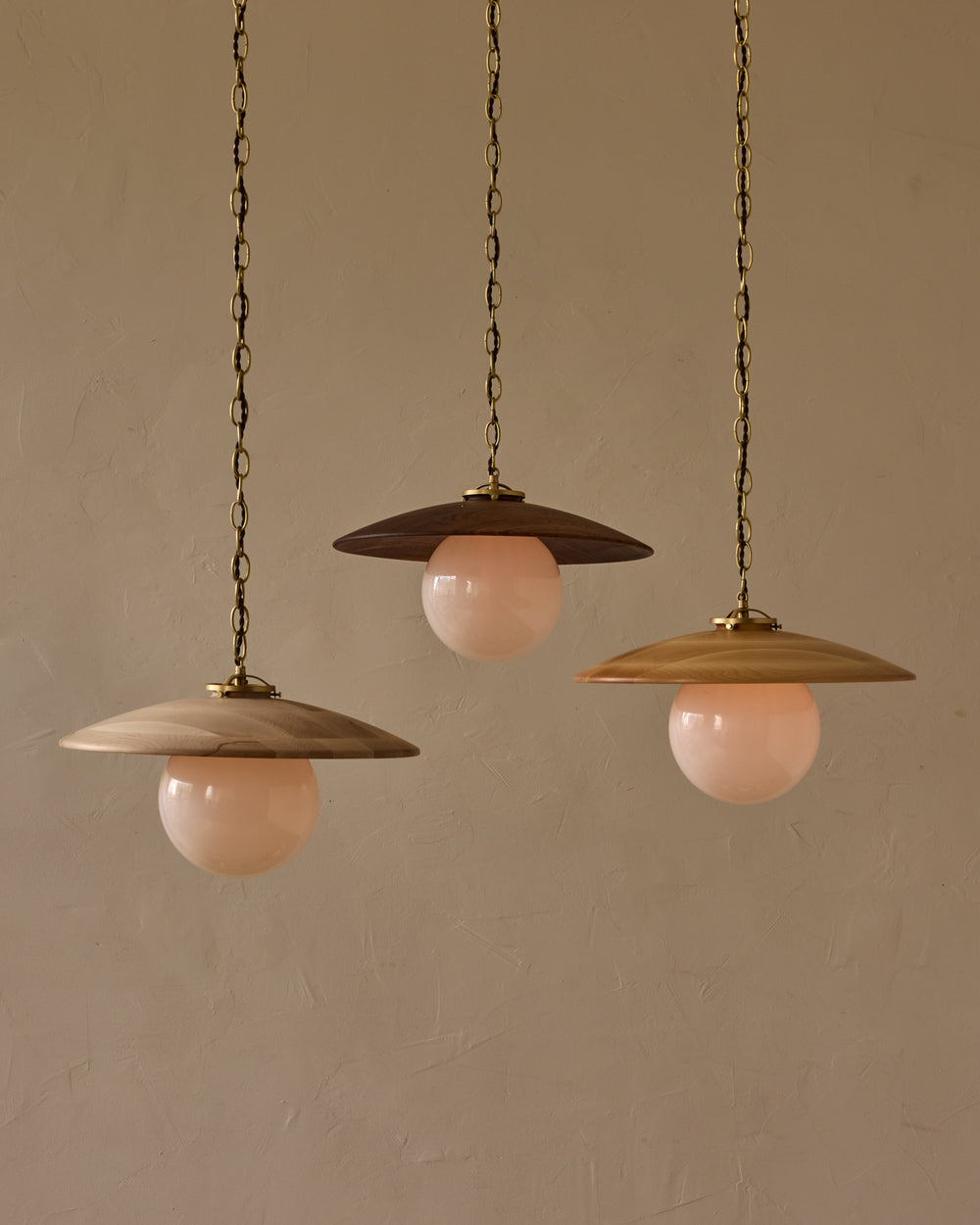 Large pendant light with oversized clear glass globe and decorative wooden clear maple shade with brass chain  #shade-finish_natural maple #globe_white glass #cord-color_brown