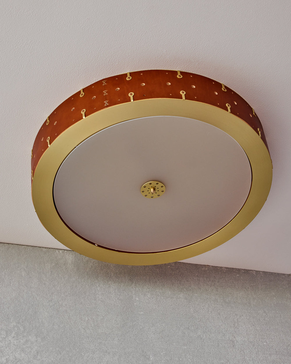 Beautiful satin brass flush mount ceiling fixture with handstitched leather drum shade #leather-finish_tan harness #size_24" drum
