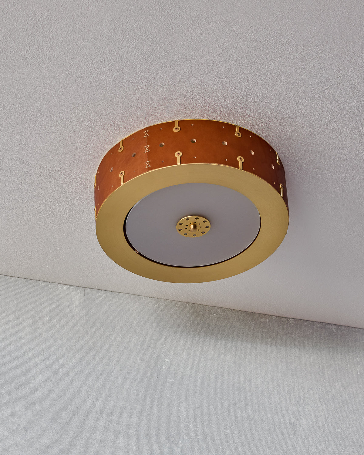 Beautiful satin brass flush mount ceiling fixture with handstitched leather drum shade #size_14" drum #leather-finish_tan harness