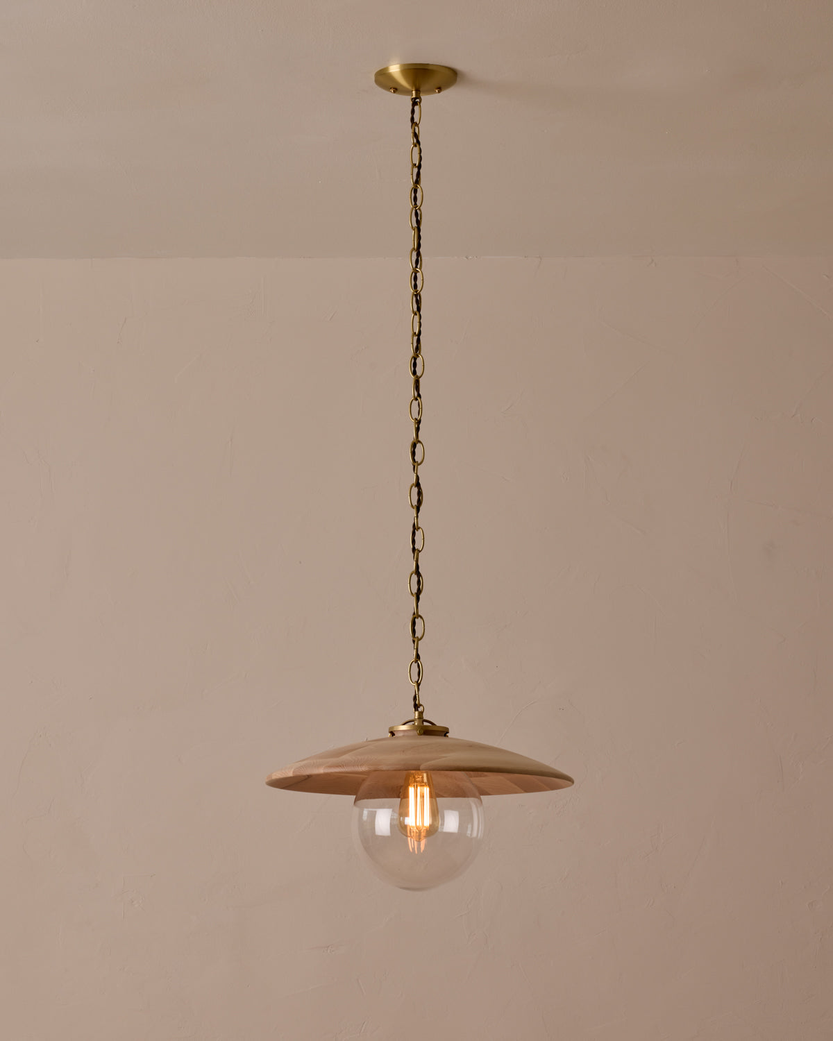 Large pendant light with oversized clear glass globe and decorative wooden clear maple shade with brass chain #shade-finish_clear maple #globe_clear glass #cord-color_brown