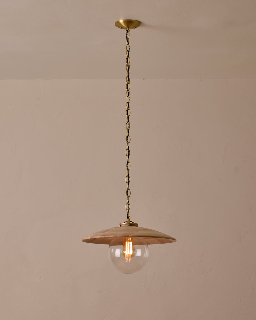Large pendant light with oversized clear glass globe and decorative wooden clear maple shade with brass chain #shade-finish_clear maple #globe_clear glass #cord-color_brown