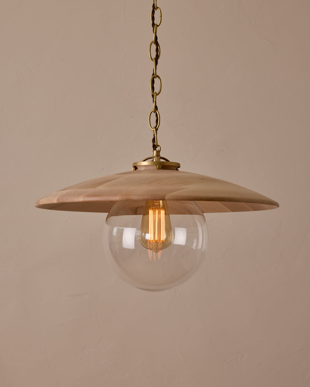 Large pendant light with oversized clear glass globe and decorative wooden clear maple shade with brass chain #shade-finish_clear maple #globe_clear glass #cord-color_brown