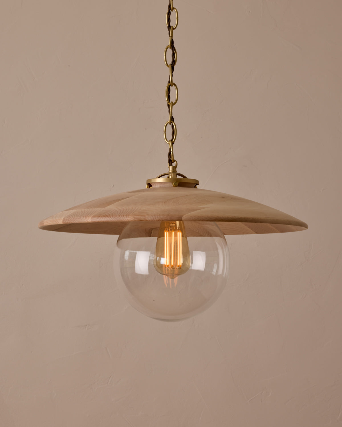 Large pendant light with oversized clear glass globe and decorative wooden clear maple shade with brass chain #shade-finish_clear maple #globe_clear glass #cord-color_brown