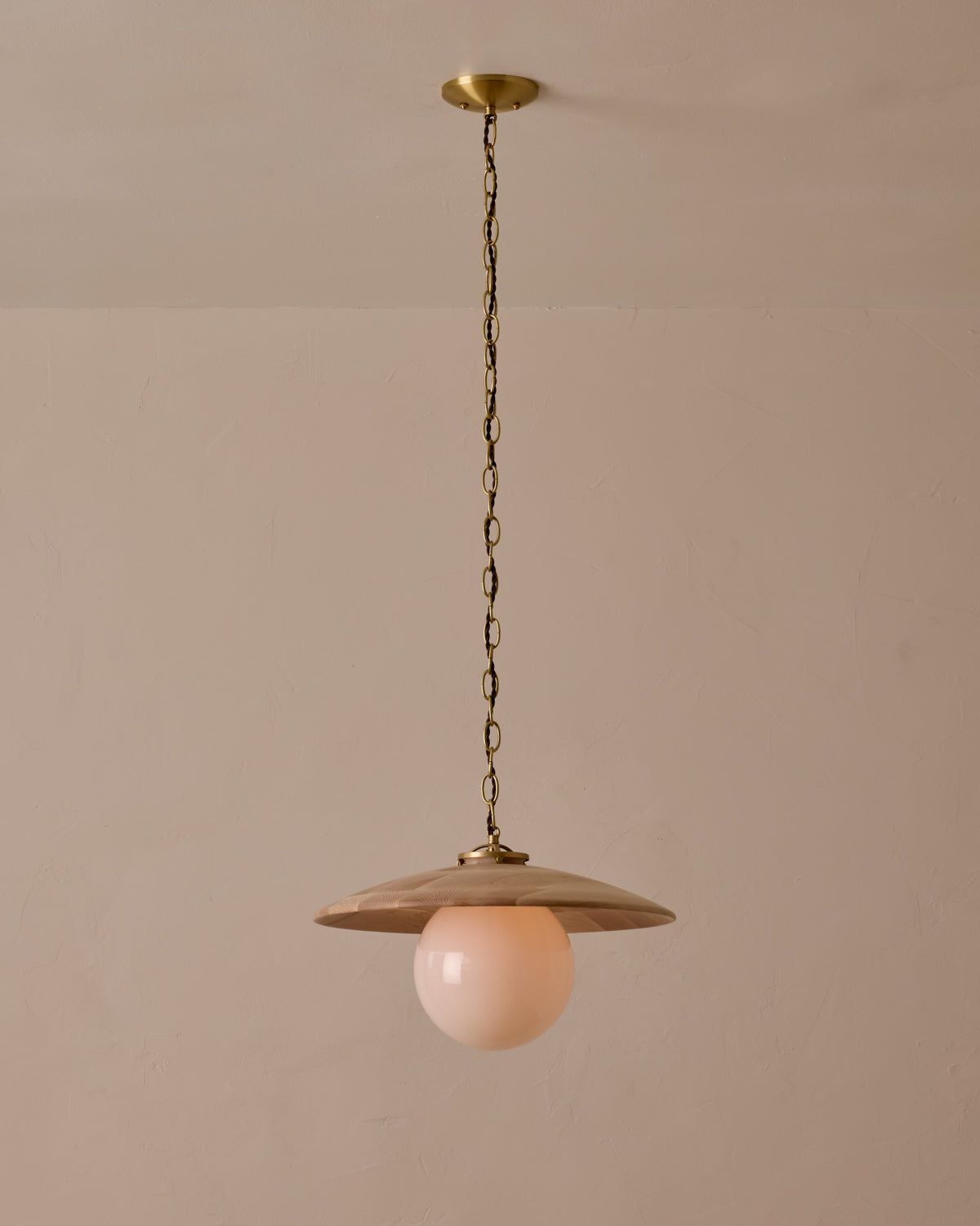 Large pendant light with oversized milk glass globe and decorative wooden clear maple shade with brass chain #shade-finish_clear maple #globe_white glass #cord-color_brown