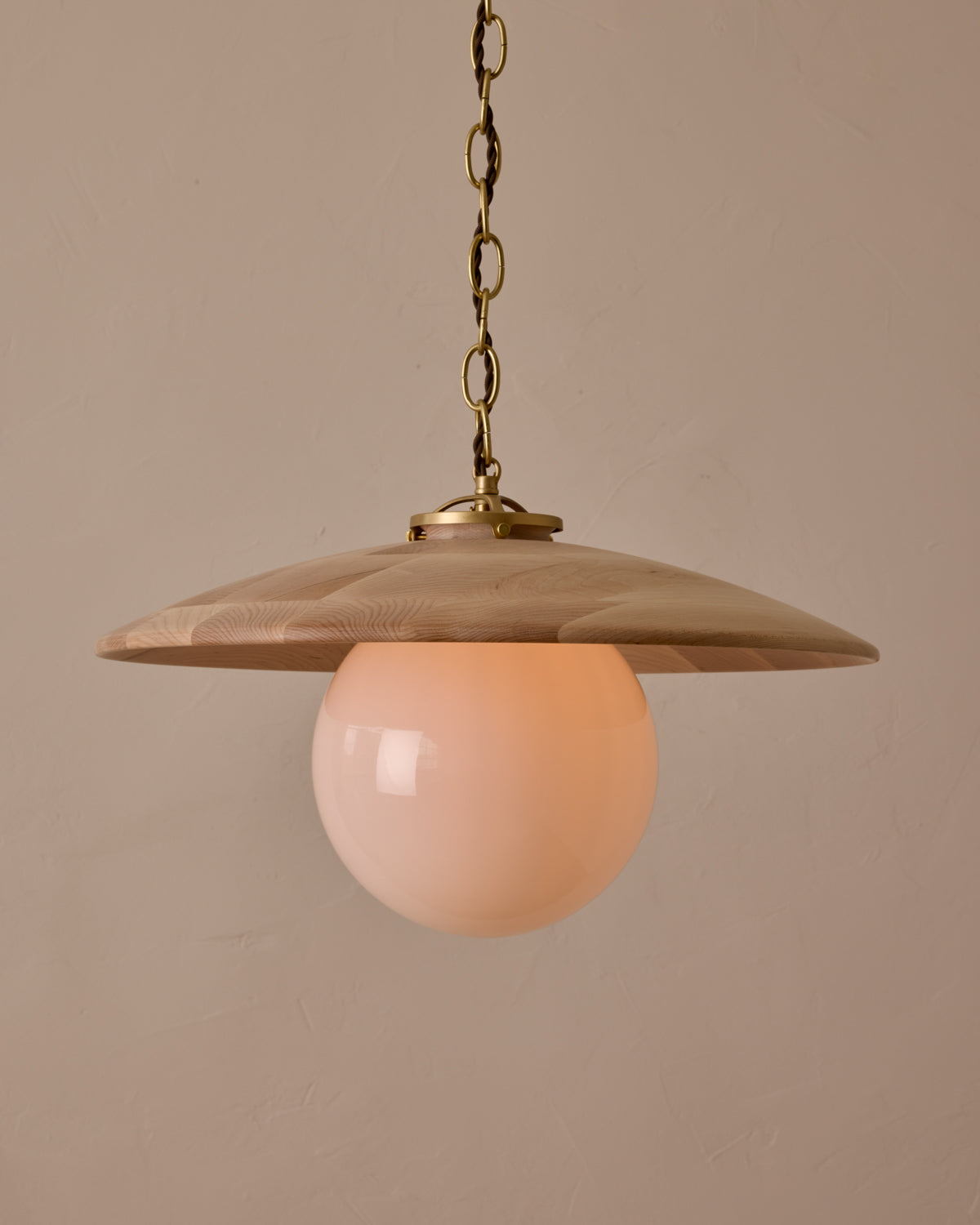 Large pendant light with oversized milk glass globe and decorative wooden clear maple shade with brass chain #shade-finish_clear maple #globe_white glass #cord-color_brown