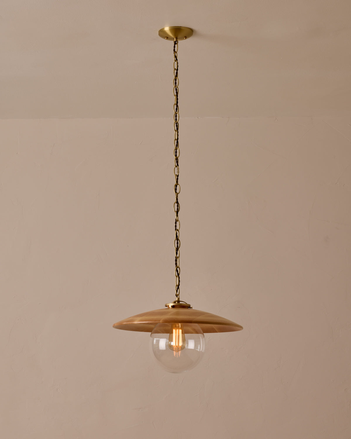 Large pendant light with oversized clear glass globe and decorative wooden clear maple shade with brass chain  #shade-finish_natural maple #globe_clear glass #cord-color_brown