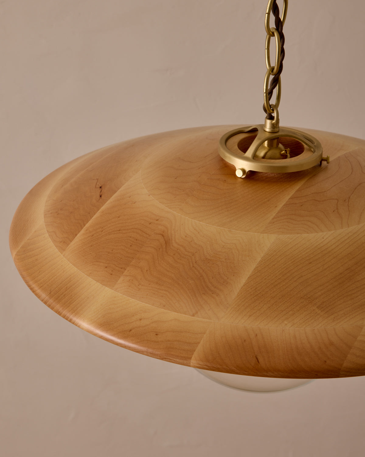 Large pendant light with oversized clear glass globe and decorative wooden clear maple shade with brass chain  #shade-finish_natural maple #globe_clear glass #cord-color_brown