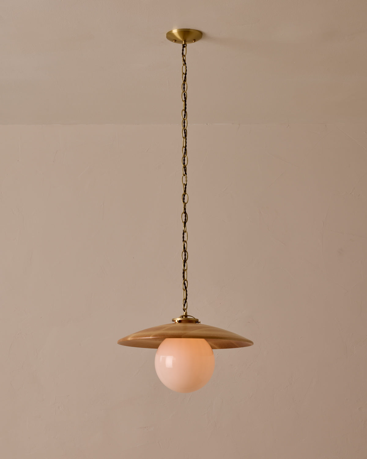 Large pendant light with oversized clear glass globe and decorative wooden clear maple shade with brass chain  #shade-finish_natural maple #globe_white glass #cord-color_brown