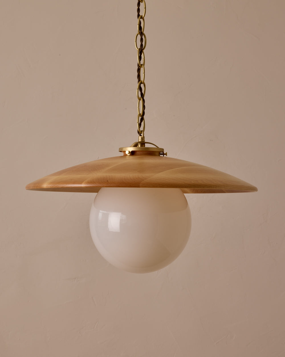 Large pendant light with oversized clear glass globe and decorative wooden clear maple shade with brass chain  #shade-finish_natural maple #globe_white glass #cord-color_brown