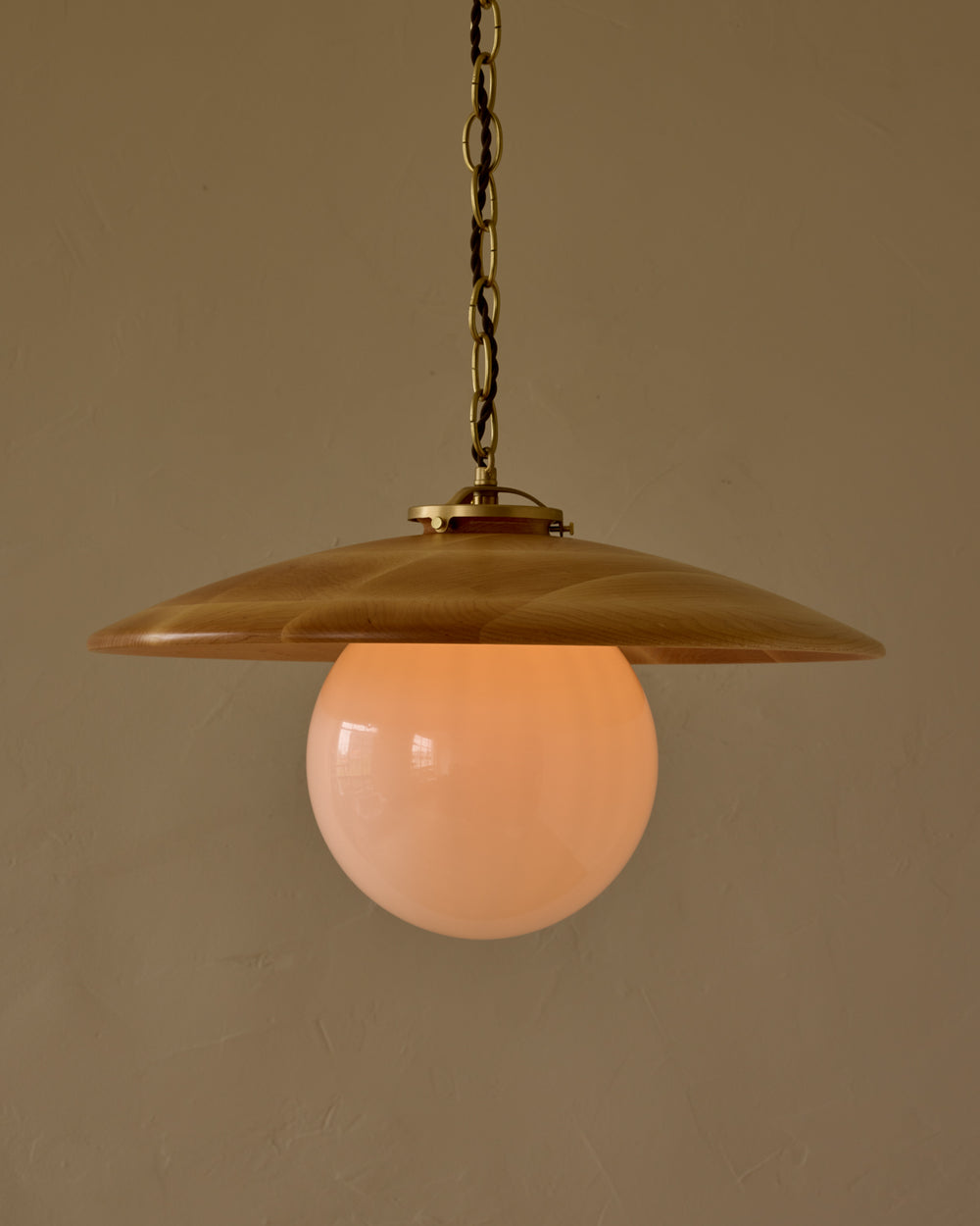 Large pendant light with oversized clear glass globe and decorative wooden clear maple shade with brass chain  #shade-finish_natural maple #globe_white glass #cord-color_brown
