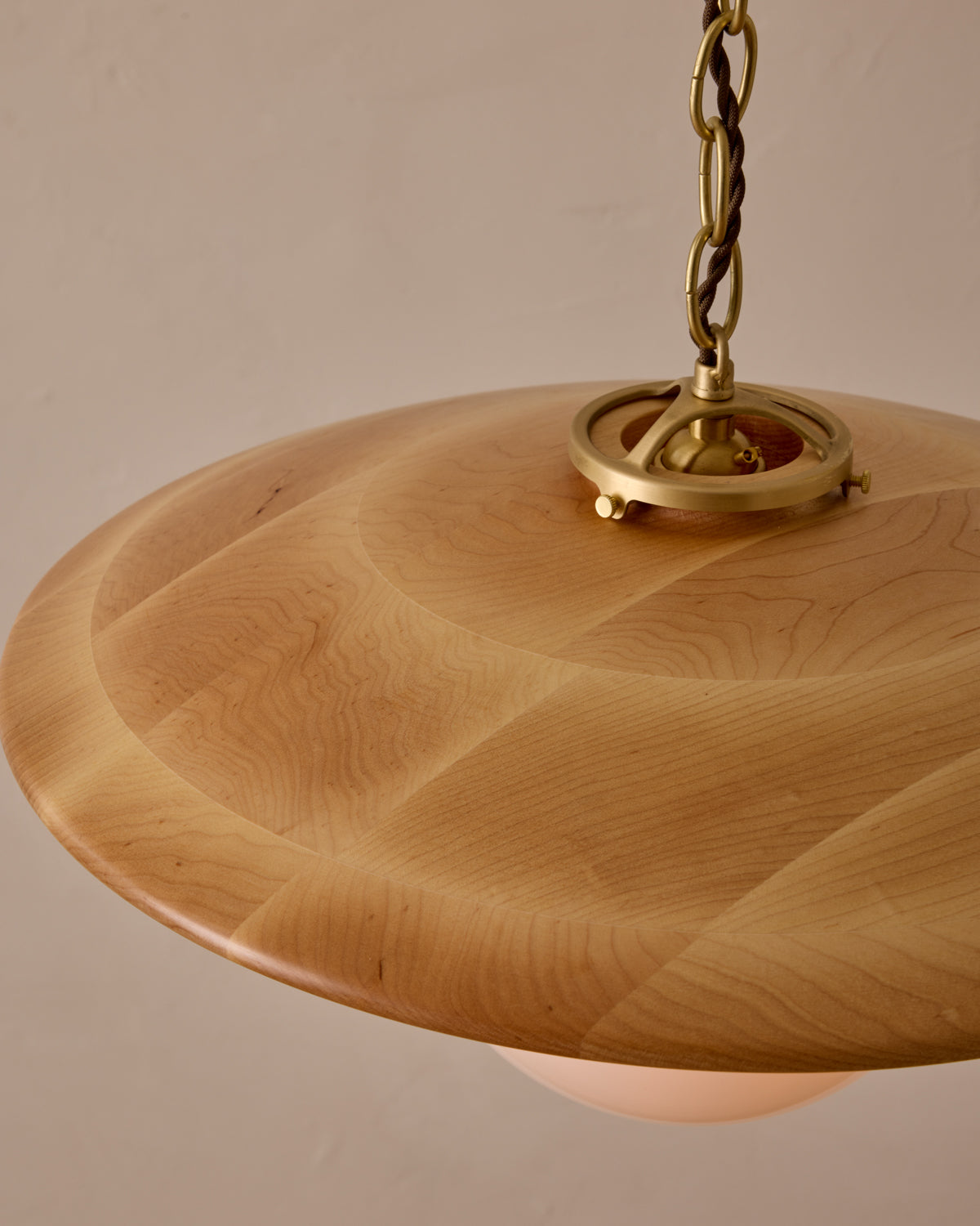 Large pendant light with oversized clear glass globe and decorative wooden clear maple shade with brass chain  #shade-finish_natural maple #globe_white glass #cord-color_brown