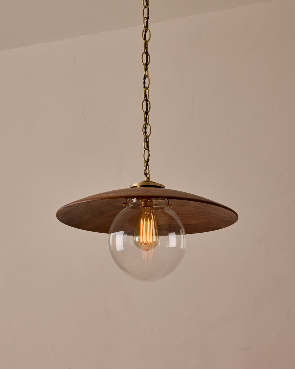 Large pendant light with oversized clear glass globe and decorative wooden clear maple shade with brass chain  #shade-finish_black walnut #globe_clear glass #cord-color_brown