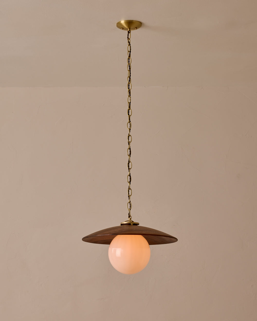 Large pendant light with oversized clear glass globe and decorative wooden clear maple shade with brass chain  #shade-finish_black walnut #globe_white glass #cord-color_brown