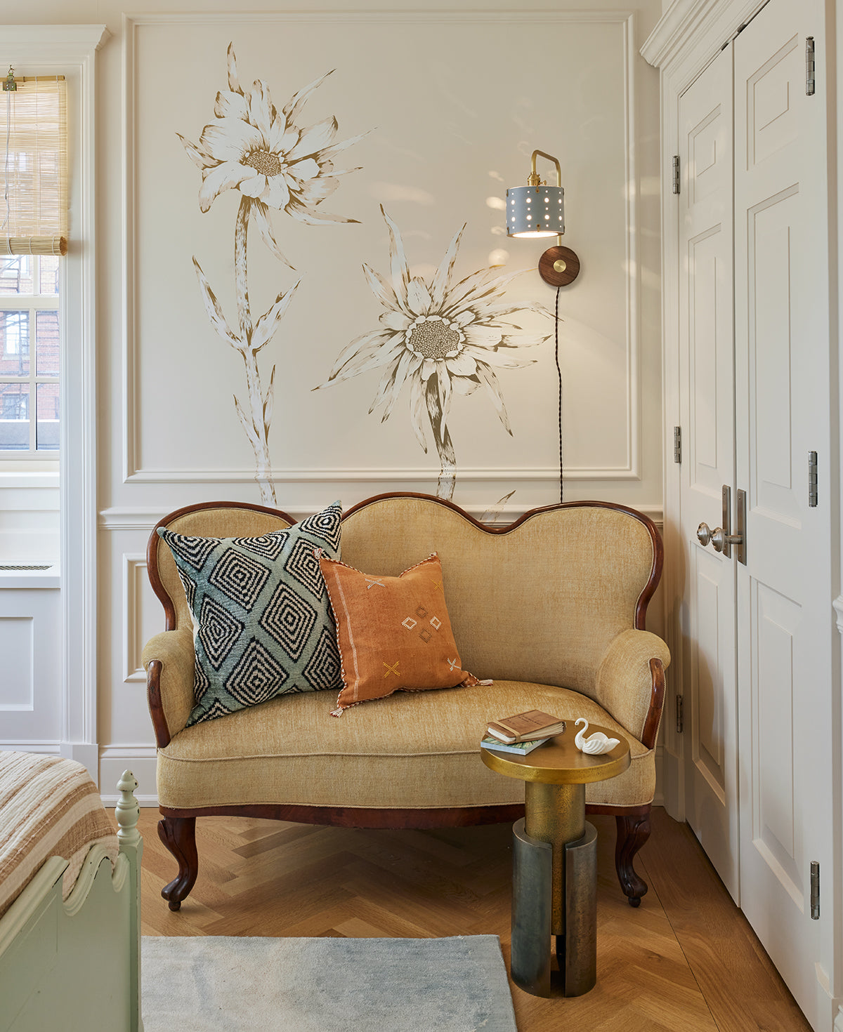 Articulating satin brass sconce with blue handstitched shade and walnut backplate in sitting room  #leather-finish_cloud blue #wiring_plug-in
