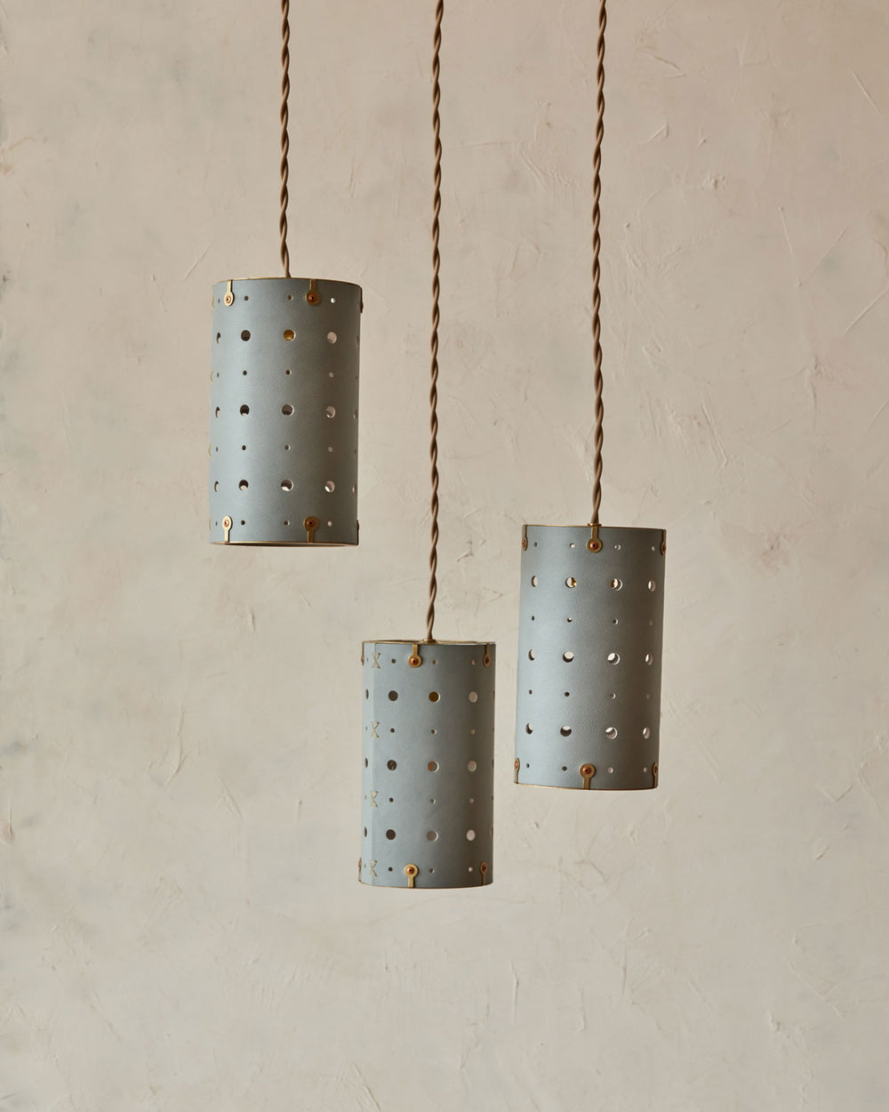 Charming leather pendant light with blue handstitched shade and brass accents  #color_cloud blue