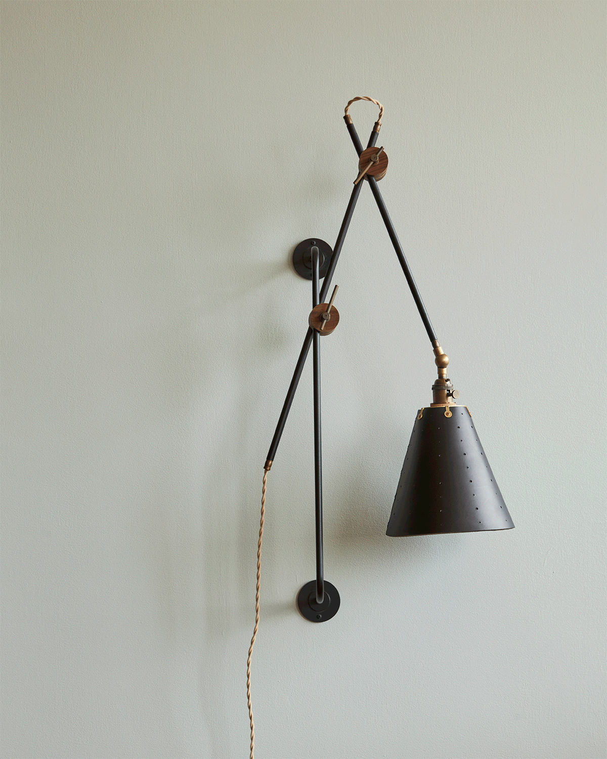 Large articulating black plug in wall sconce with black handstitched cone leather shade #shade-finish_black harness #wiring_plug-in