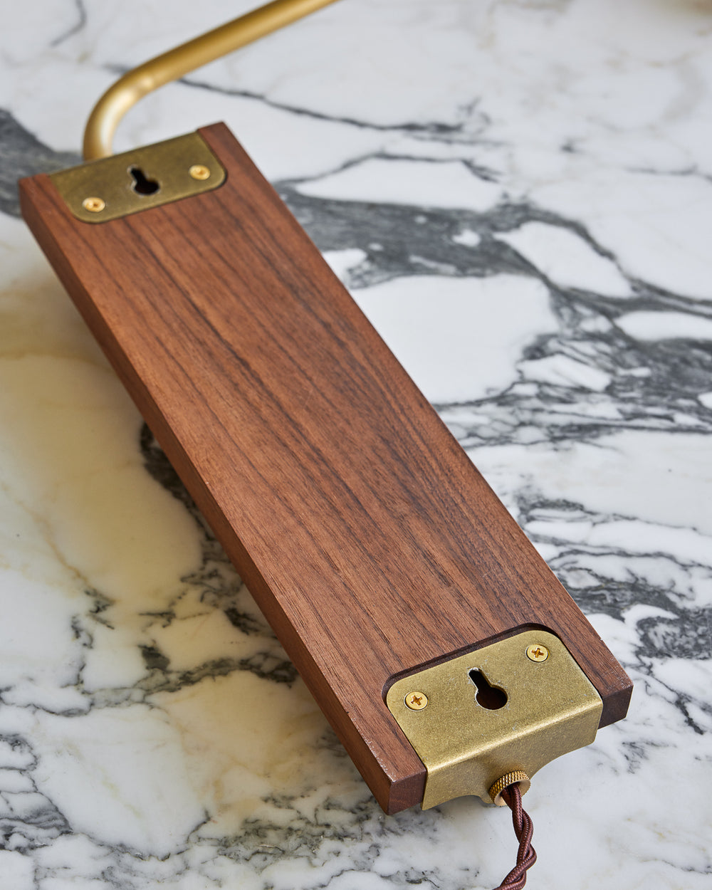 Black walnut wooden plug in wall sconce with articulating brass arm #wood-finish_black walnut #wiring_plug-in